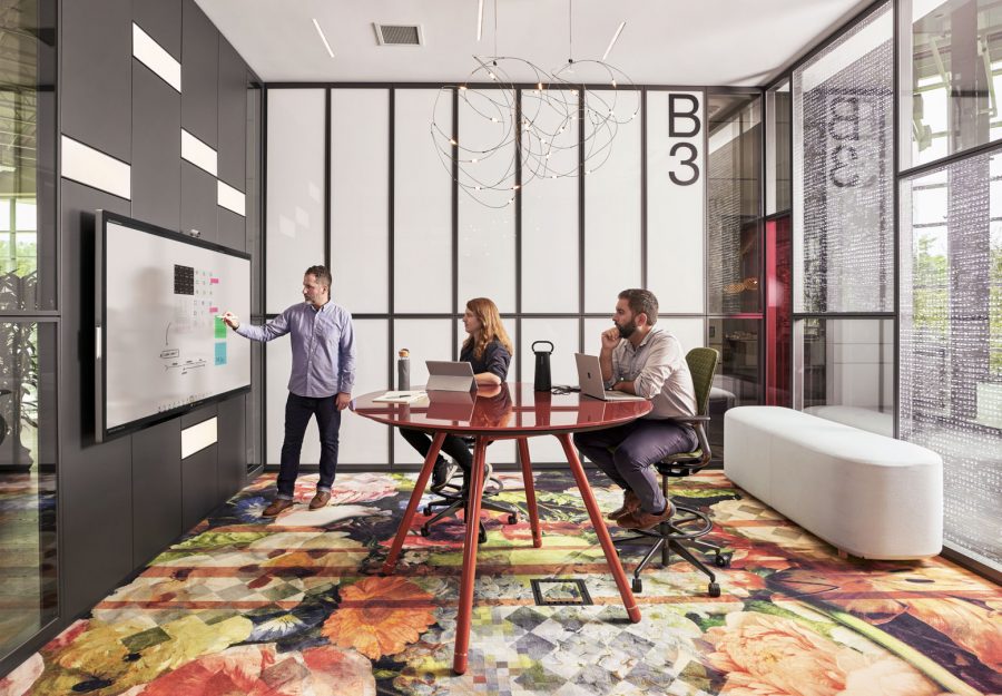 Three people having a meeting in modern office