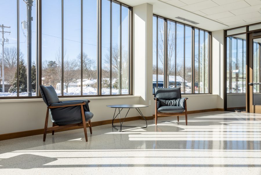 Large office window with two chairs and a table