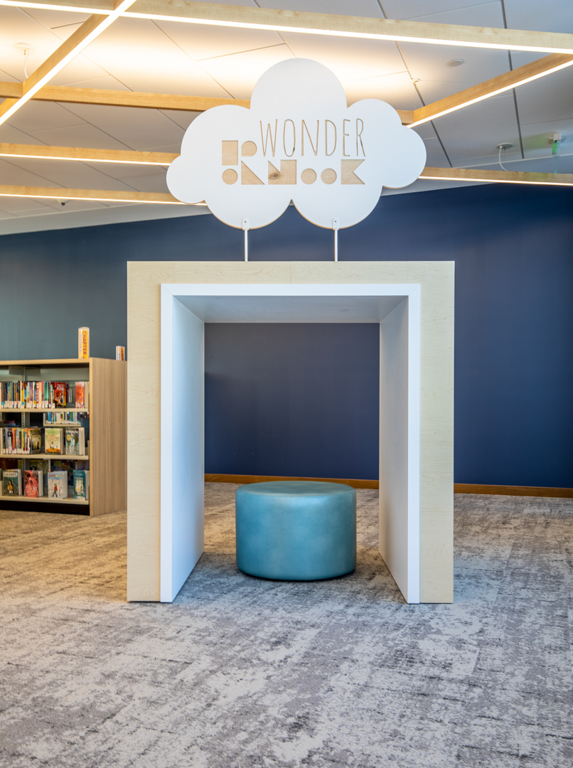 Modern library design with blue stool